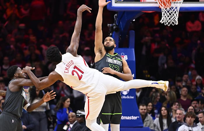 Nov 19, 2022; Philadelphia, Pennsylvania, USA; Philadelphia 76ers center Joel Embiid (21) shoots against Minnesota Timberwolves center Karl-Anthony Towns (32) in the second quarter at Wells Fargo Center. 